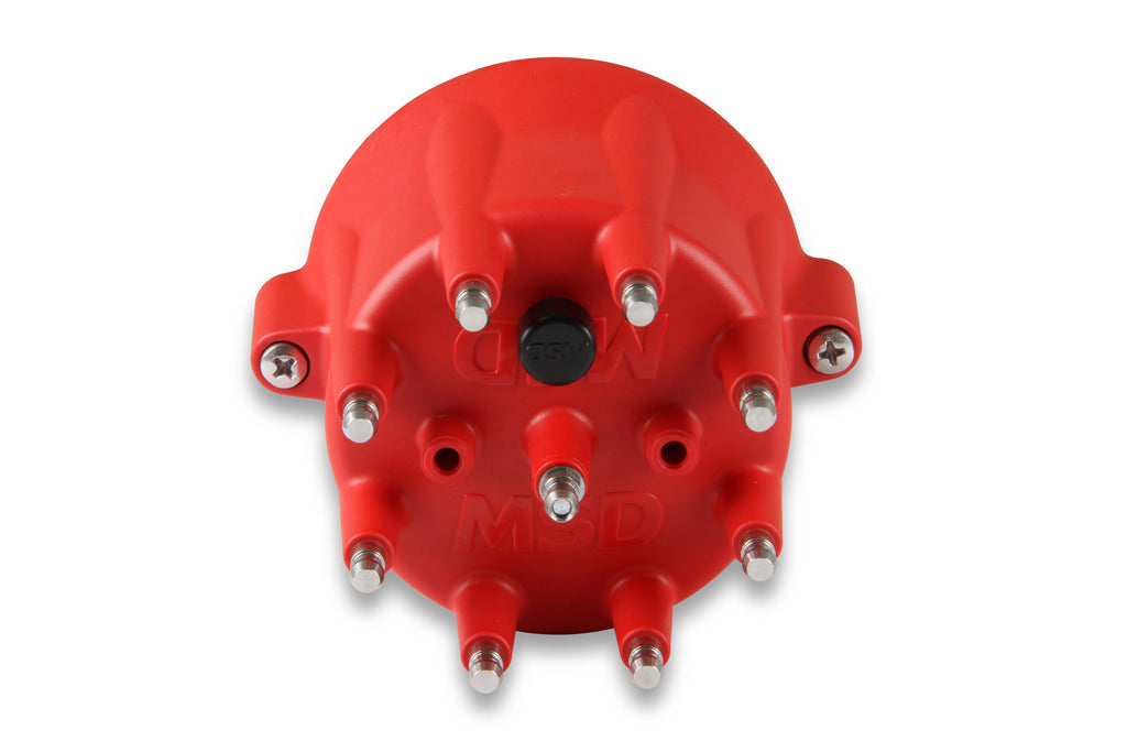 Red distributor cap with metallic bolts on a white background